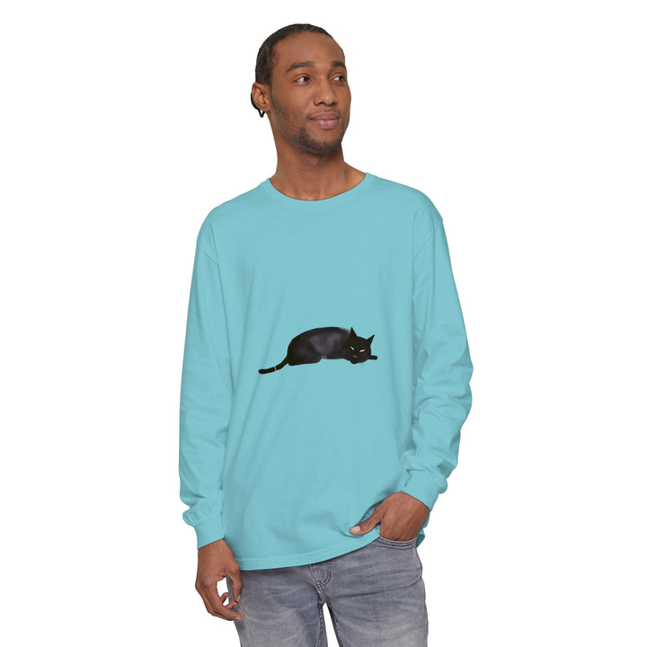 A cozy black cat sleeping on a unisex long sleeve t-shirt