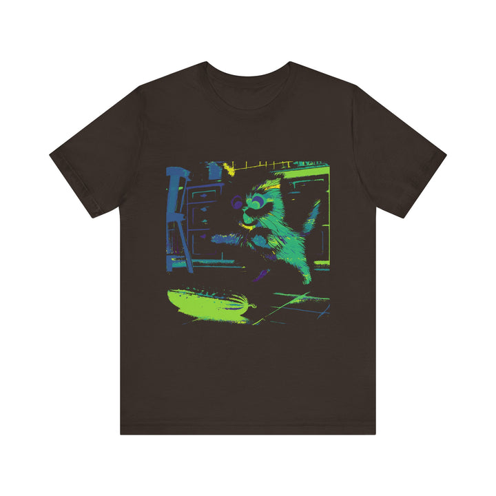 A black t-shirt with a neon silhouette of a scared cat jumping away from a cucumber