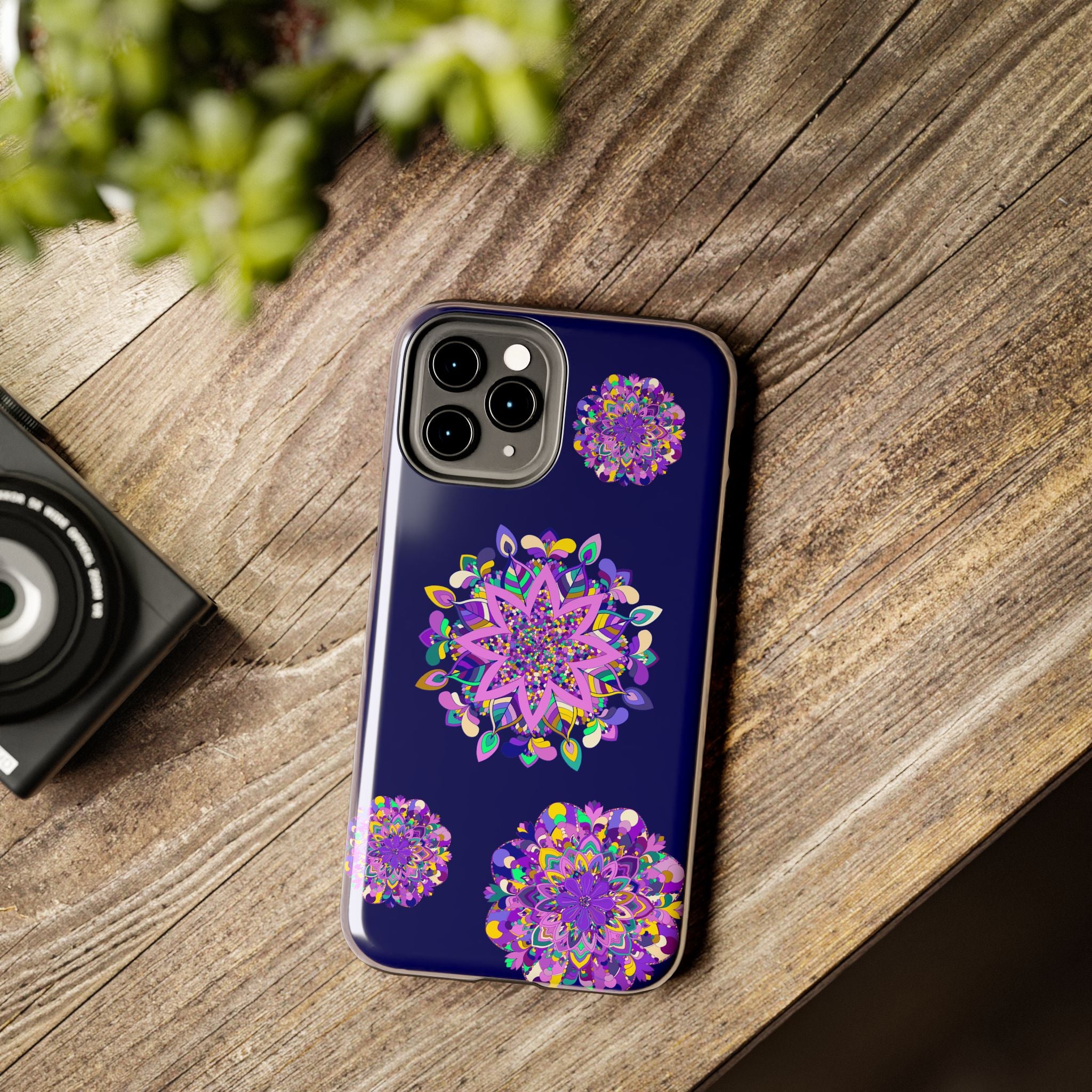 A durable and shock absorbent phone case in purple shades with hand drawn mandala art design