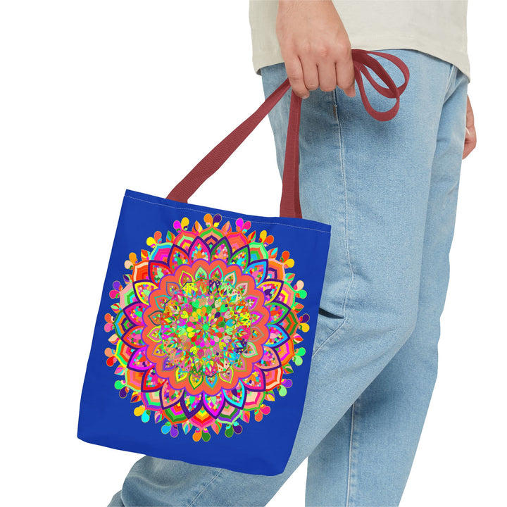 Dark blue tote bag featuring a colorful mandala art design, perfect for carrying your belongings in style