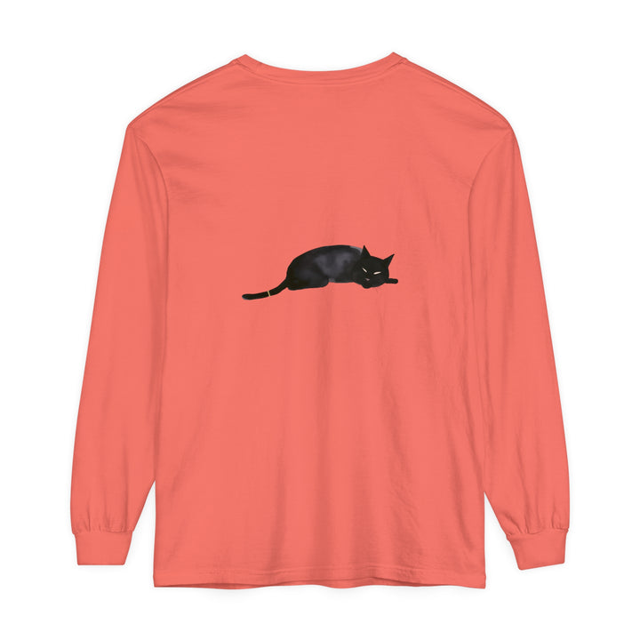 A cozy black cat sleeping on a unisex long sleeve t-shirt