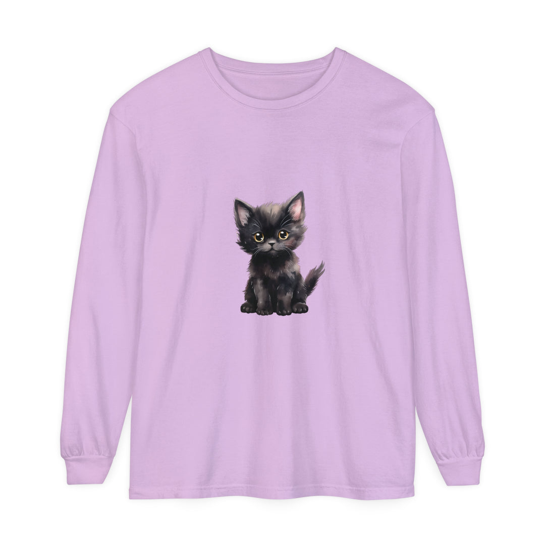 Adorable black kitten with striking yellow eyes on a cozy long sleeve t-shirt