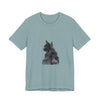 A close-up watercolor illustration of a mysterious black cat on a black t-shirt