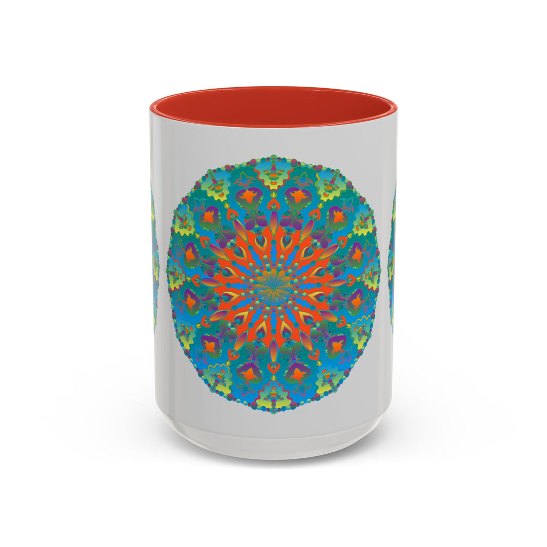 A ceramic coffee mug with a detailed mandala art design featuring intricate patterns in shades of blue and green