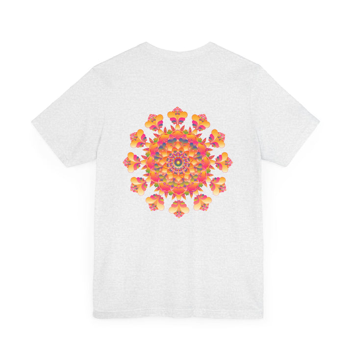 A close-up image of a colorful and intricate mandala design on a tee shirt, representing spiritual peace and harmony through vibrant colors and sacred geometry