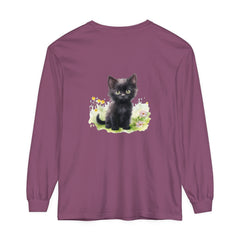 A cute black kitten exploring a colorful flower garden on a long sleeve t-shirt