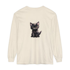 A cute black kitten with vibrant yellow eyes on a long sleeve t-shirt