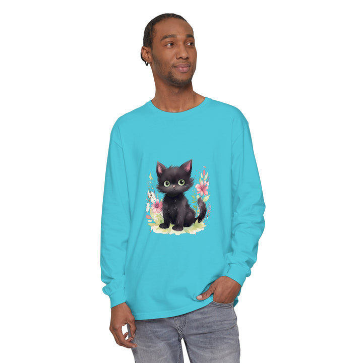 A cute and playful kitten surrounded by colorful floral watercolor designs on a T-shirt