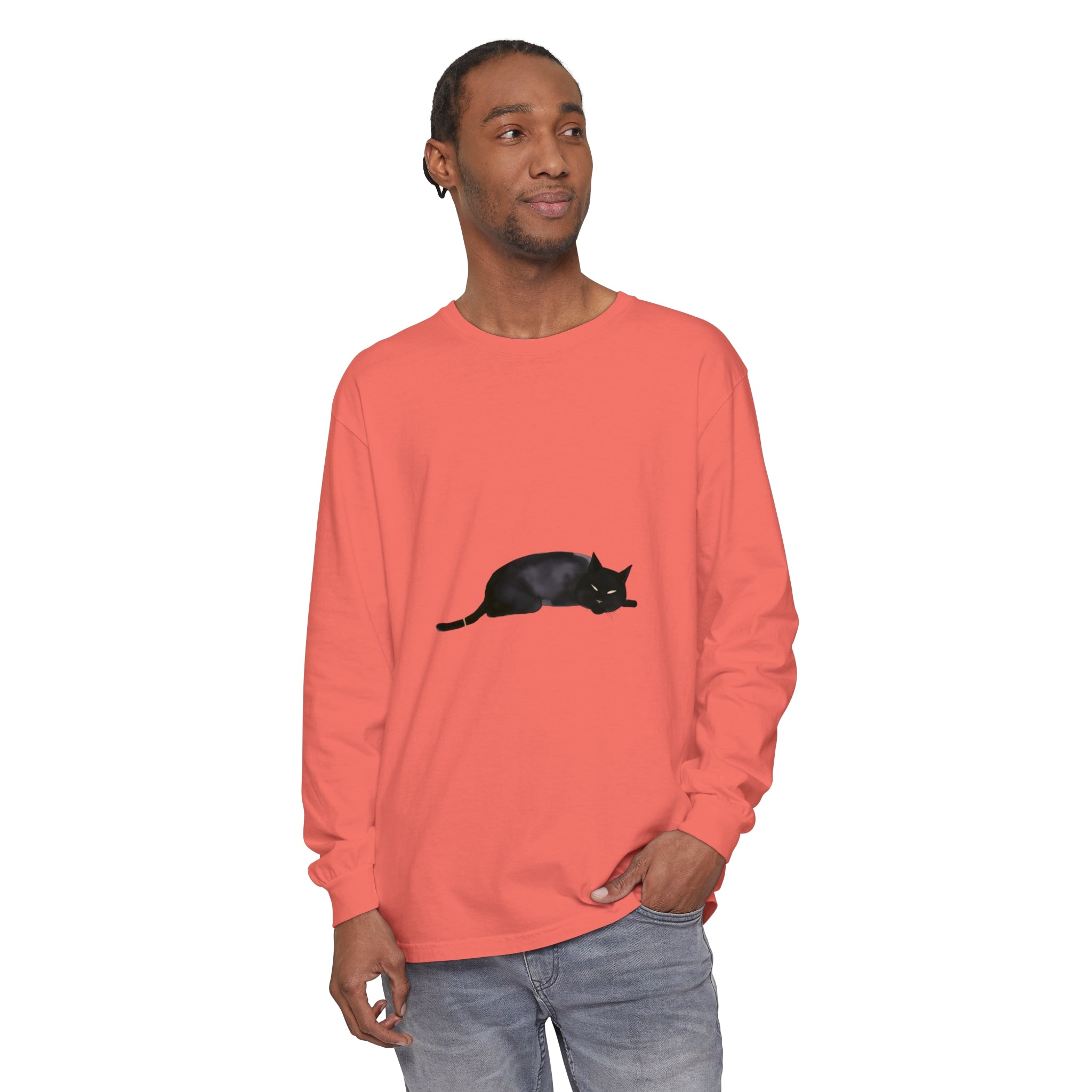 A cozy black cat sleeping on a unisex long sleeve t-shirt