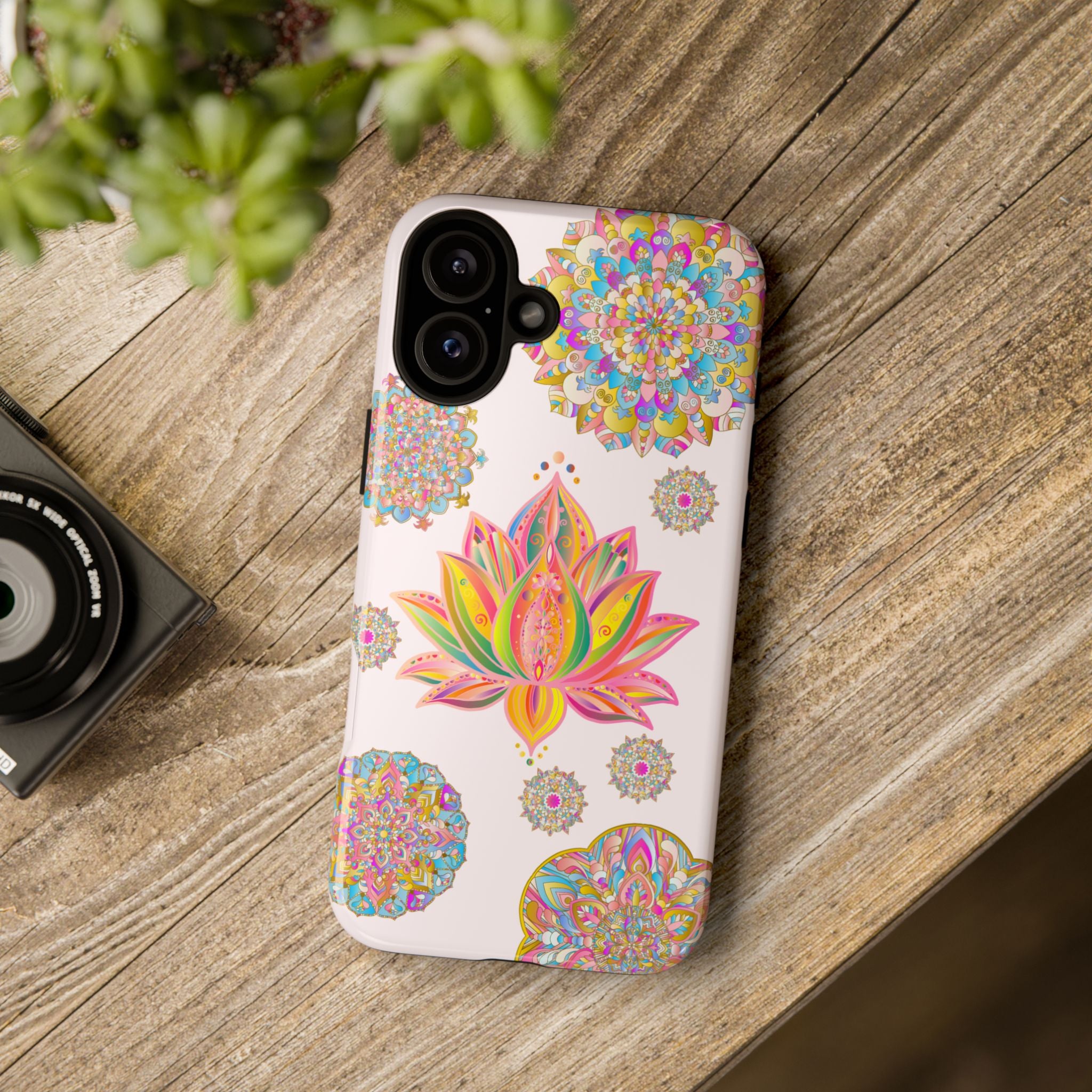 A light pink phone case with a mandala design featuring a beautiful lotus flower