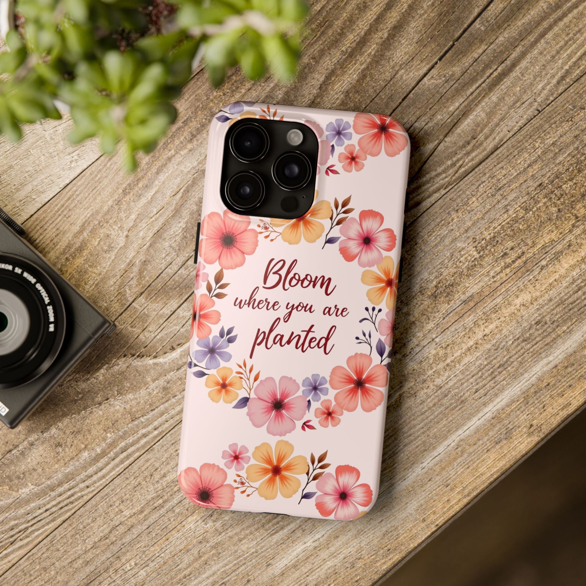 A beautiful light pink phone case with a flower garland bloom design