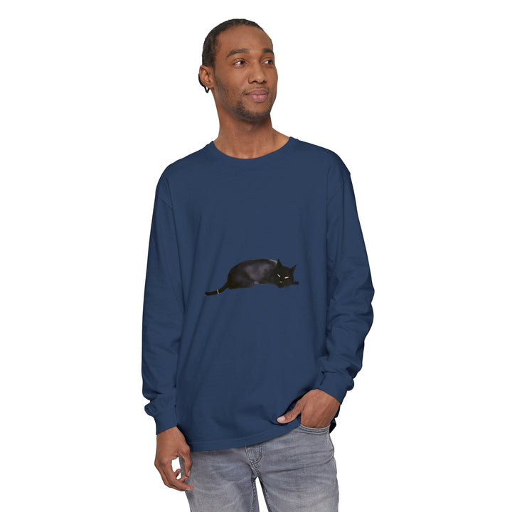 A relaxed black cat sleeping peacefully on a unisex long sleeve t-shirt