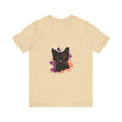 A close-up image of a black t-shirt with a mysterious black cat design and vibrant purple eyes
