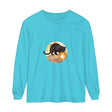 Graphic t-shirt featuring a black cat sitting on a rooftop, with a full moon and starry night sky in the background