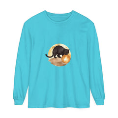 Graphic t-shirt featuring a black cat sitting on a rooftop, with a full moon and starry night sky in the background