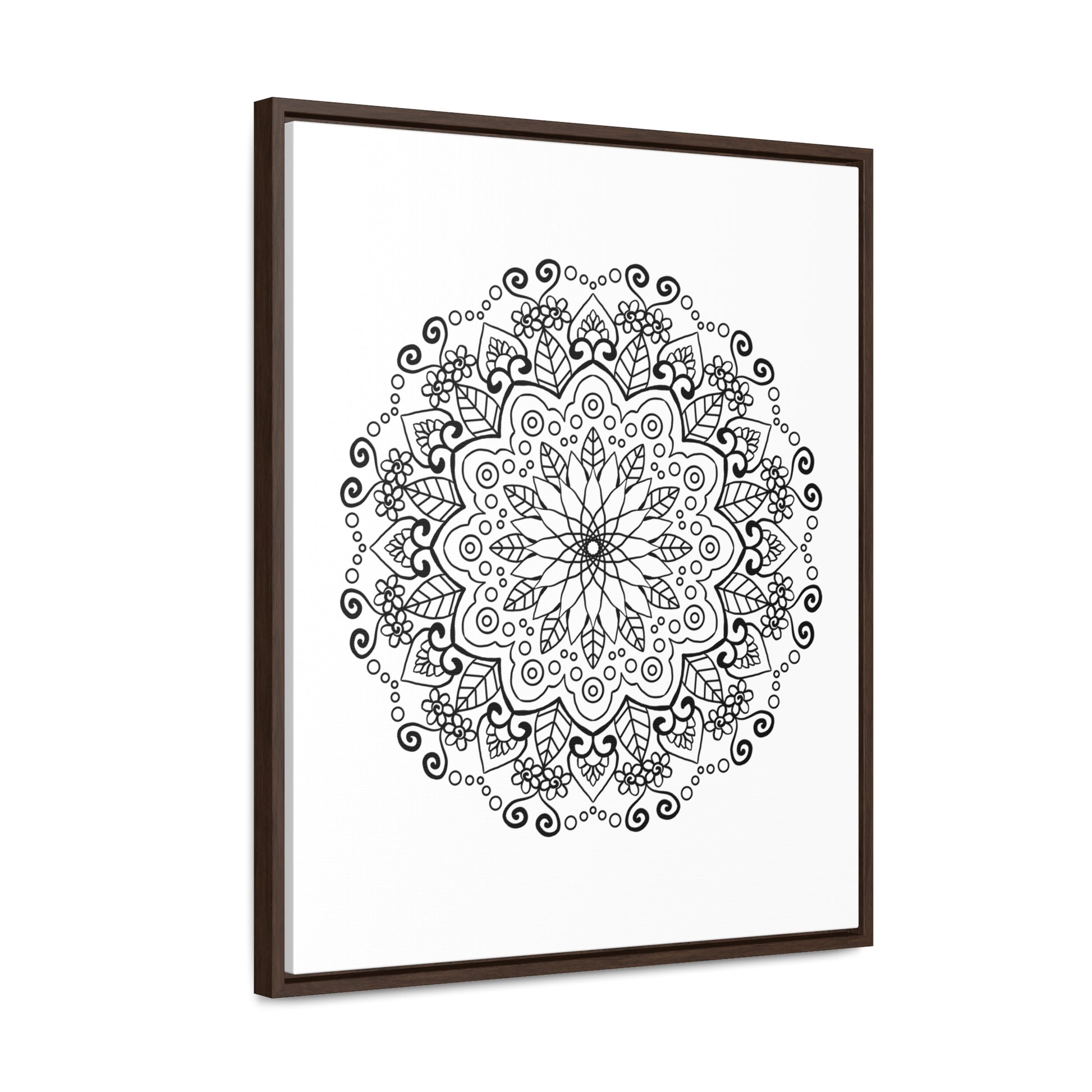 A stunning black and white handmade mandala art piece on gallery canvas wraps, beautifully displayed in a vertical frame