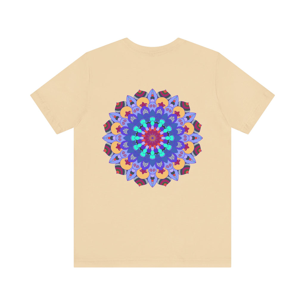 A close-up image of a white t-shirt featuring a vibrant mandala design with peaceful and harmonious elements, perfect for those seeking spiritual art