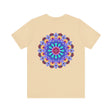 A close-up image of a white t-shirt featuring a vibrant mandala design with peaceful and harmonious elements, perfect for those seeking spiritual art