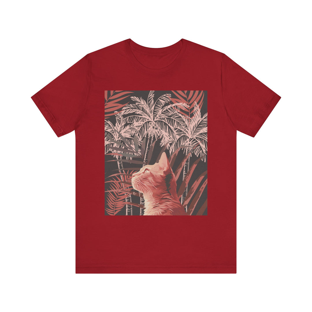 A vibrant and playful graphic tee featuring a ginger cat relaxing under a palm tree