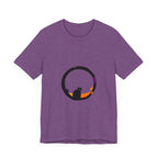 A black cat with glowing green eyes stands in front of a full moon, wearing a mysterious and stylish t-shirt with a spooky design