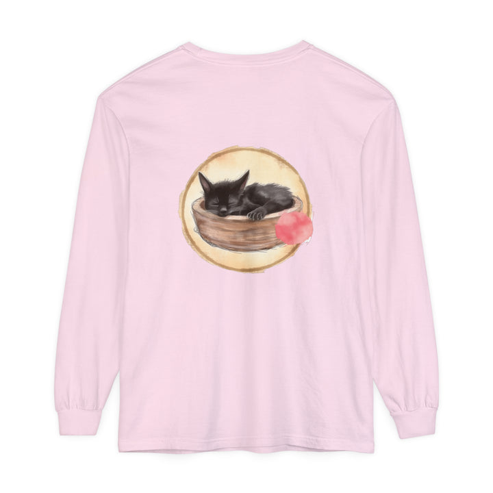 A watercolor illustration of a sleeping cat in a bowl, featured on a long sleeve t-shirt