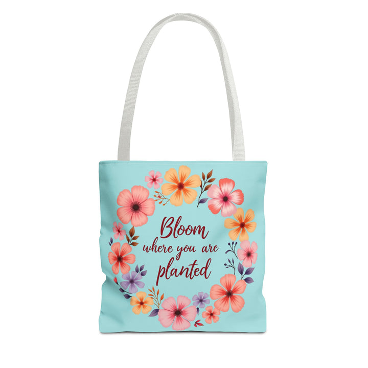 Large canvas tote bag with vibrant floral design, featuring the quote 'Bloom Where You Are Planted,' available in three different sizes