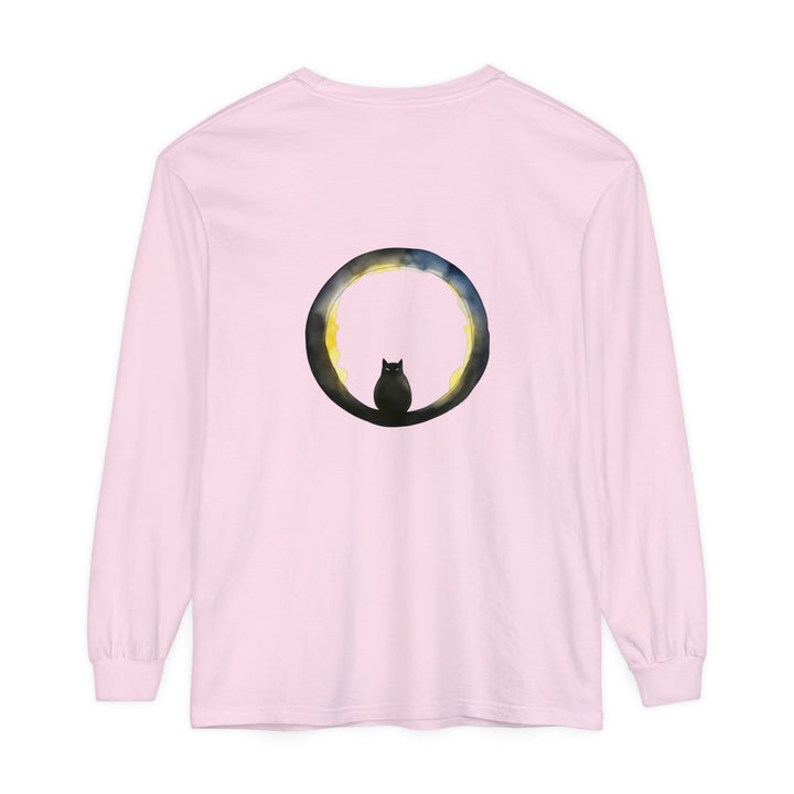 A black cat with glowing eyes sits on a crescent moon against a spooky Halloween background, featured on a stylish t-shirt