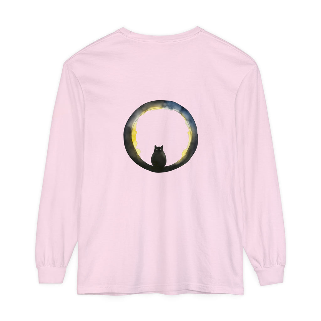 A black cat with glowing eyes sits on a crescent moon against a spooky Halloween background, featured on a stylish t-shirt