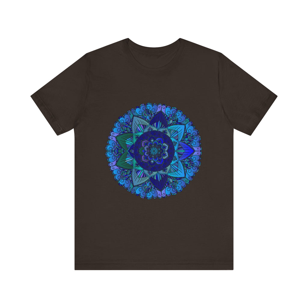 A close-up image of a dark blue and green mandala t-shirt featuring intricate spiritual art designs