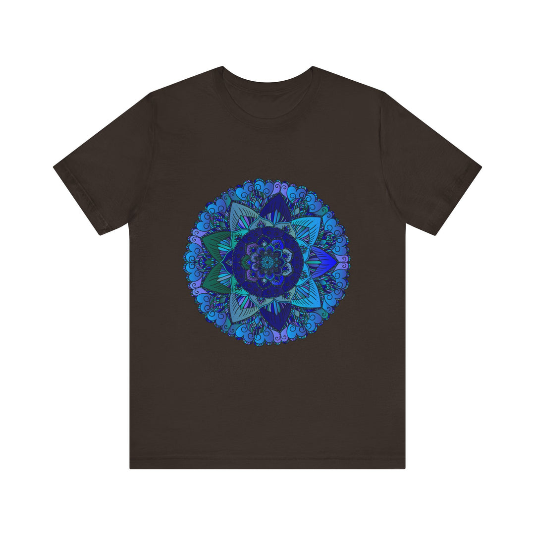 A close-up image of a dark blue and green mandala t-shirt featuring intricate spiritual art designs