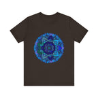 A close-up image of a dark blue and green mandala t-shirt featuring intricate spiritual art designs