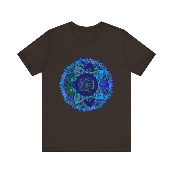 A close-up image of a dark blue and green mandala t-shirt featuring intricate spiritual art designs