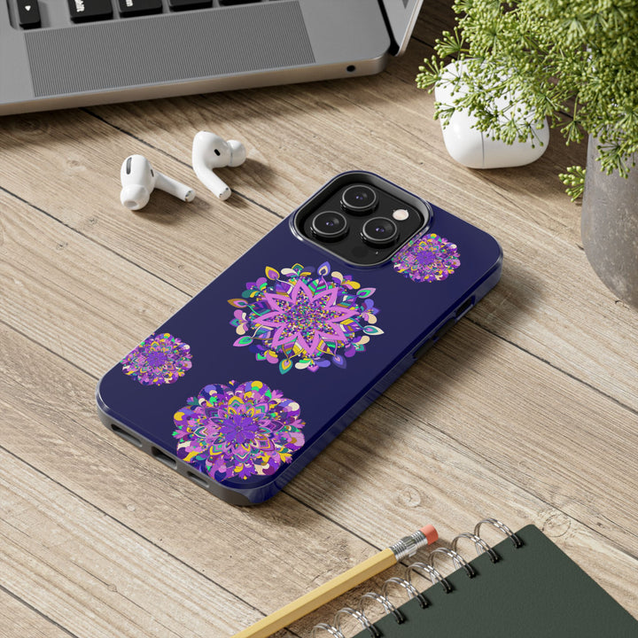 A durable and shock absorbent phone case with a hand drawn mandala art design in purple shades