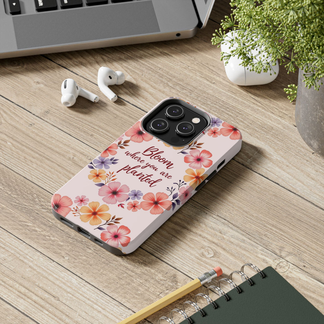 Beautiful light pink phone case adorned with a flower garland bloom design