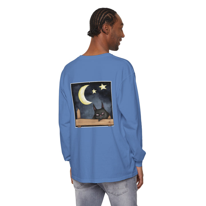 A black t-shirt with a cute sleepy cat design under the night sky