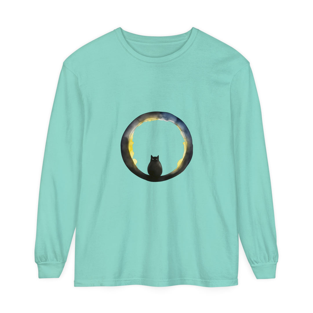 A stylish black cat sitting on a crescent moon against a Halloween-themed background, featured on a comfortable and festive T-shirt