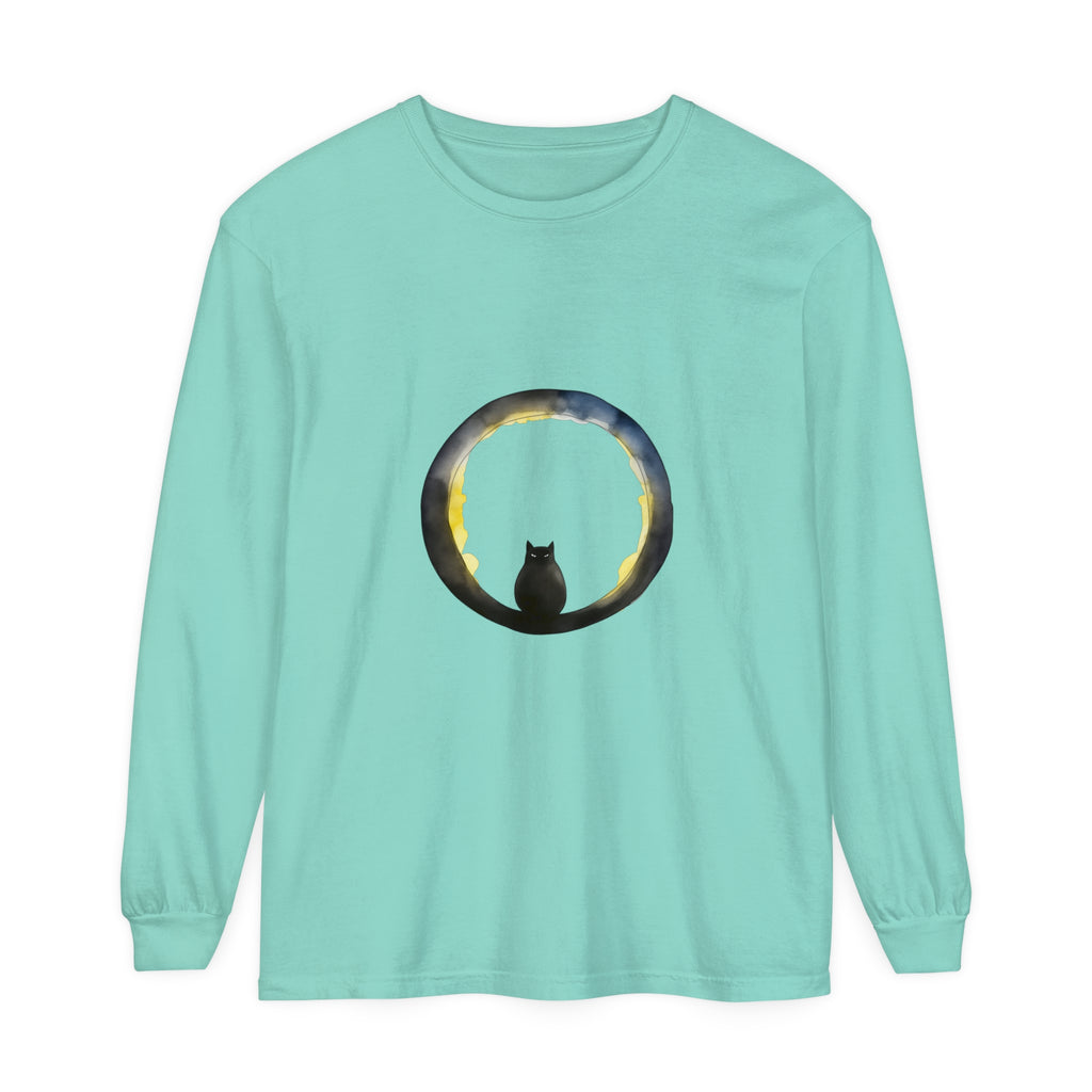 A stylish black cat sitting on a crescent moon against a Halloween-themed background, featured on a comfortable and festive T-shirt