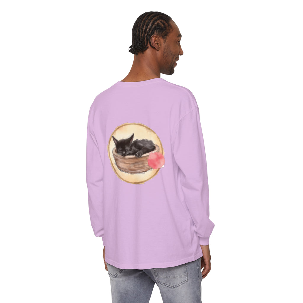 A watercolor illustration of a cozy, sleeping cat nestled inside a bowl on a long sleeve t-shirt