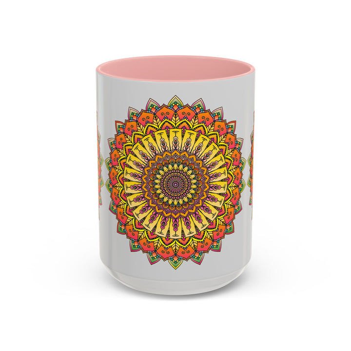 A vibrant mandala mug featuring colorful art against a grey background