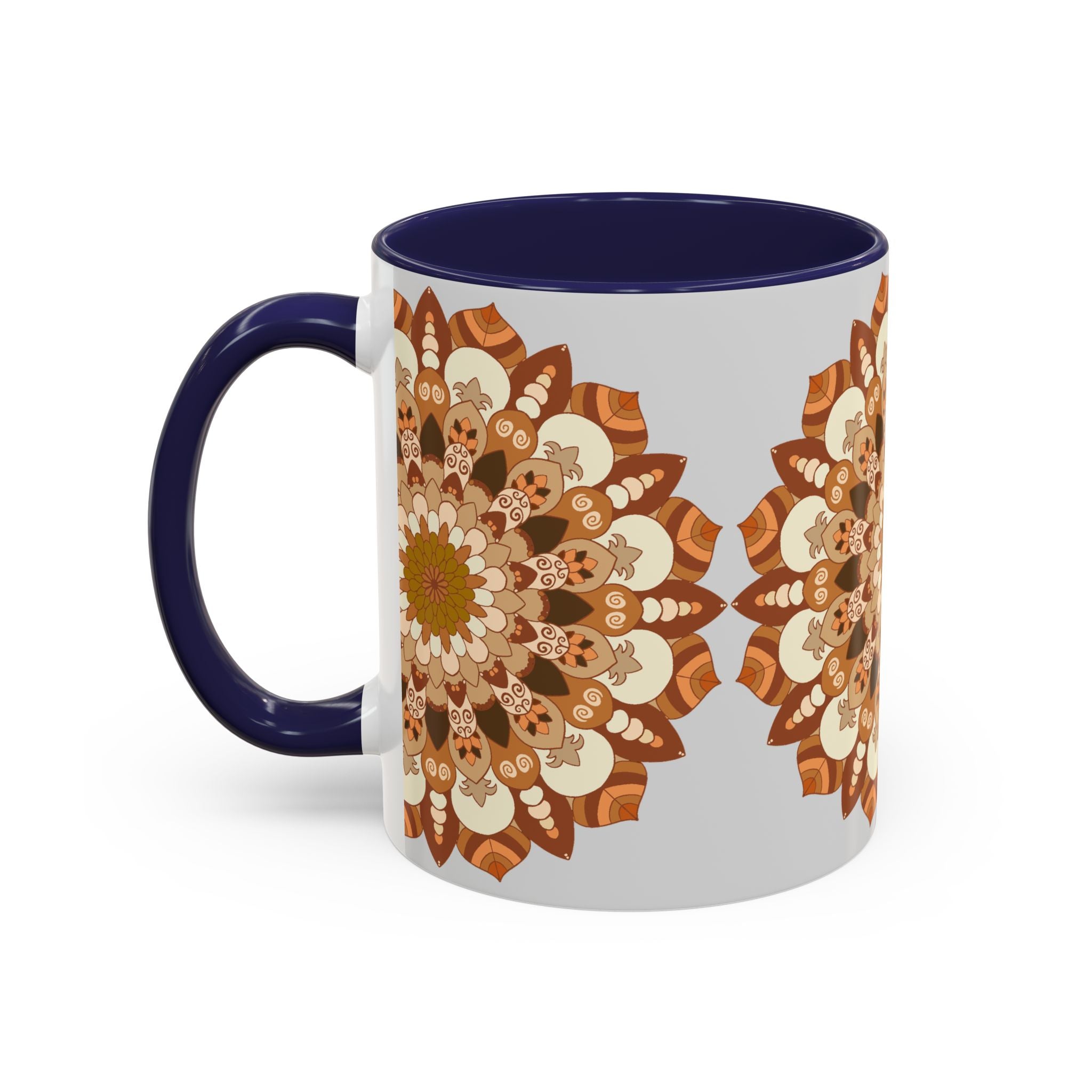 A ceramic mug with a mandala art design in shades of grey against a light grey background