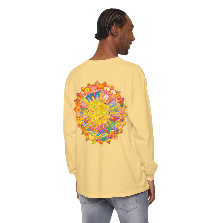 A vibrant and detailed mandala design adorns this unisex long sleeve t-shirt, perfect for adding a unique and eye-catching touch to your wardrobe