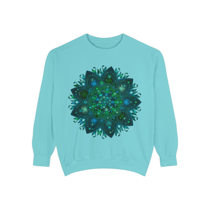 A cozy teal and blue sweatshirt featuring an intricate mandala design