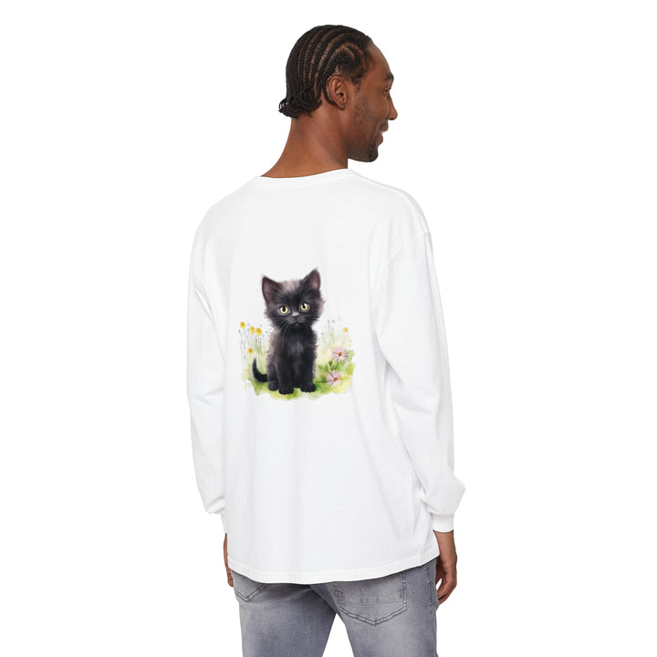 A playful black kitten relaxes in a colorful flower garden, featured on a stylish and cozy long sleeve t-shirt