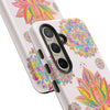 A light pink phone case with a mandala design featuring a beautiful lotus flower