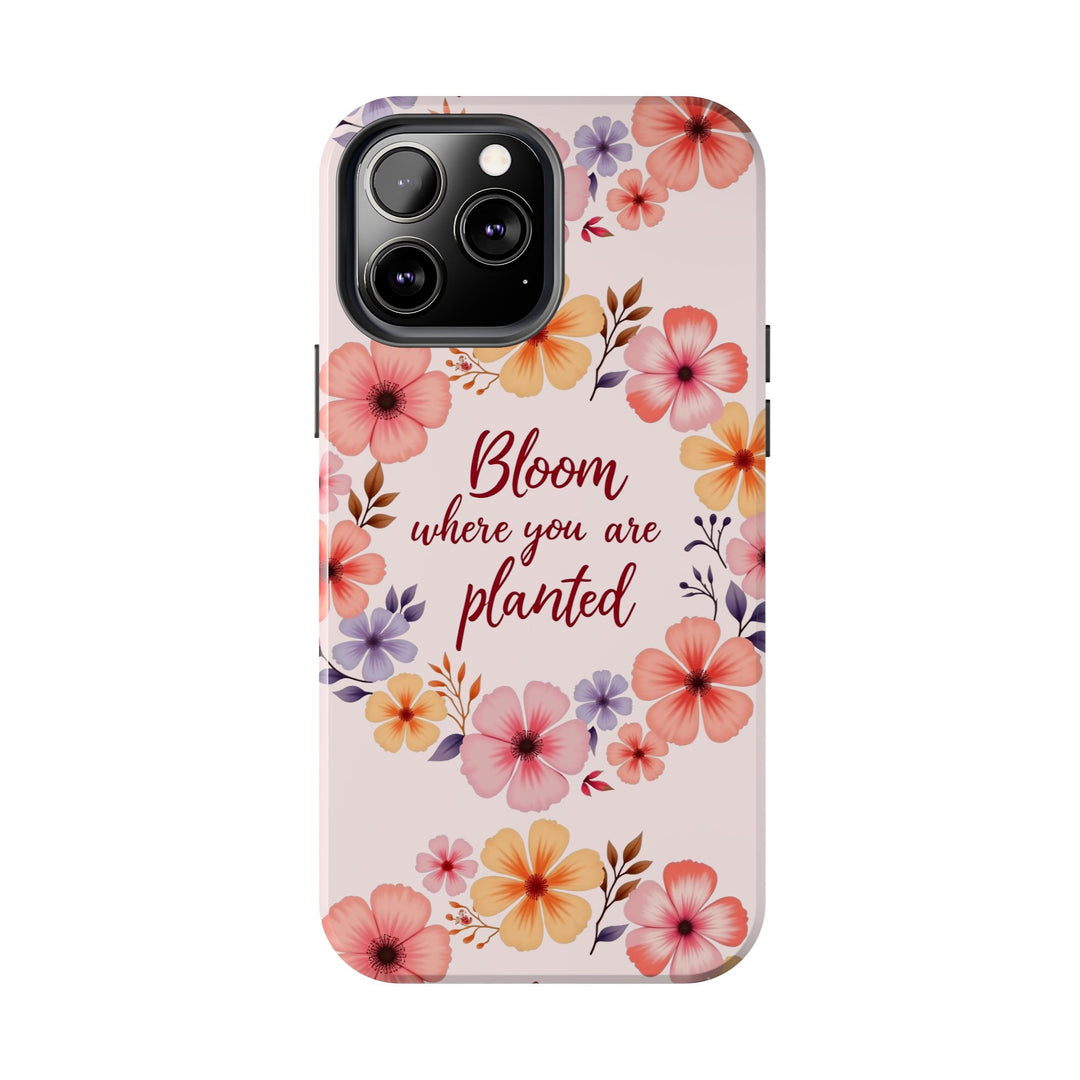 A light pink phone case with a beautifully detailed flower garland design