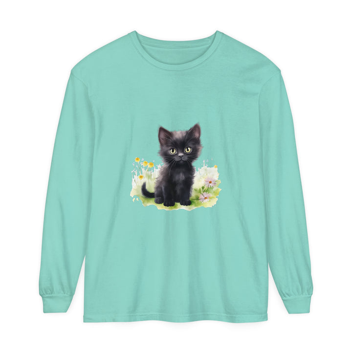 A cute black kitten surrounded by colorful flowers on a long sleeve t-shirt