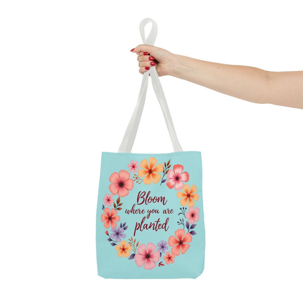 A colorful floral tote bag with the quote Bloom Where You Are Planted available in 3 sizes