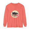 A watercolor illustration of a sleeping cat in a bowl on a long sleeve t-shirt