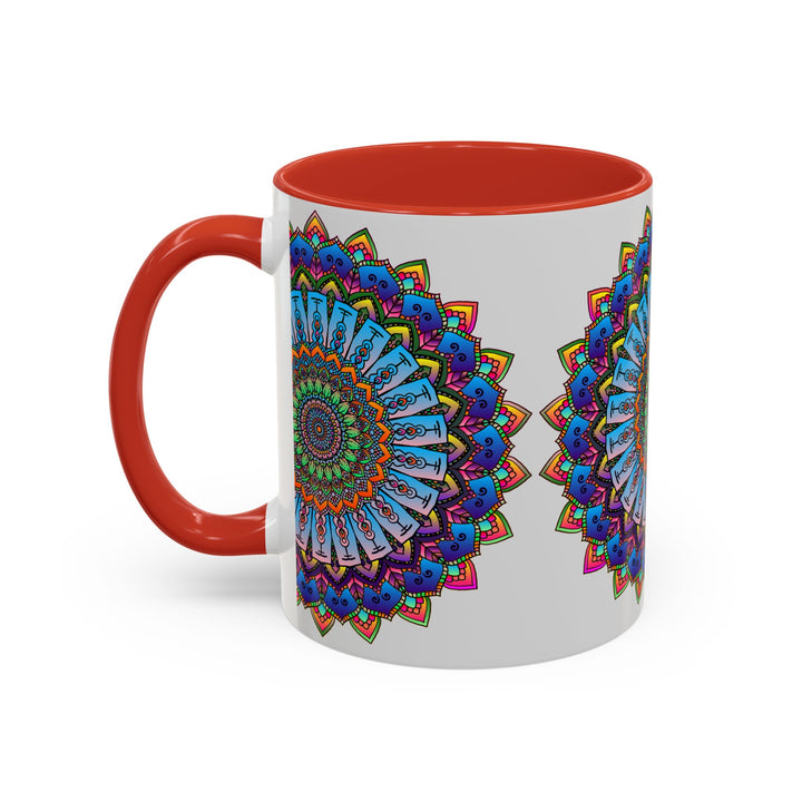 A close-up image of a vibrant mandala mug with colorful art on a grey background, showcasing intricate and detailed design