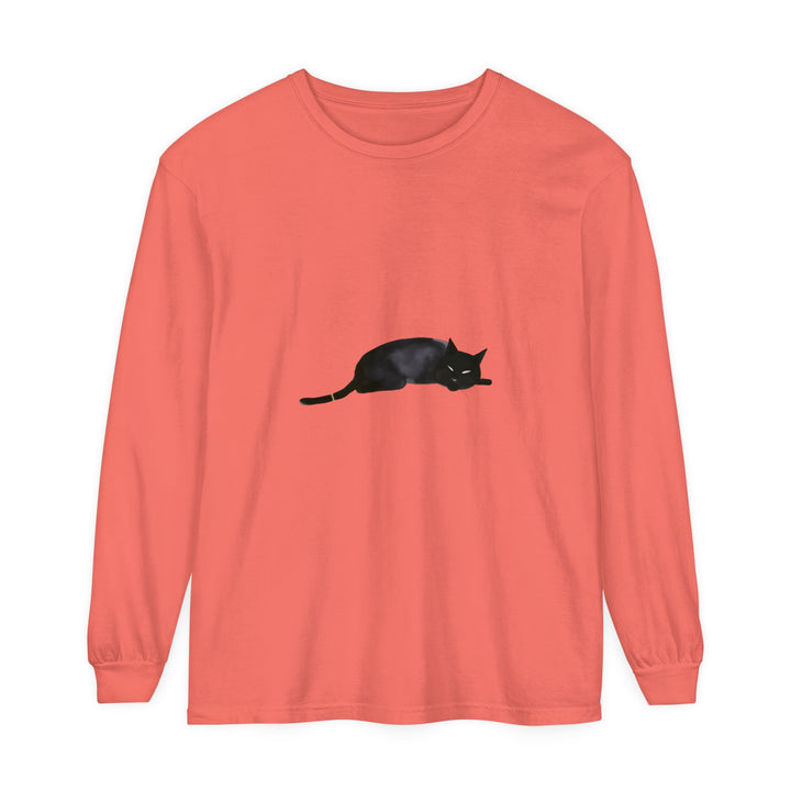 A cozy black cat sleeps peacefully on a comfortable unisex long sleeve t-shirt